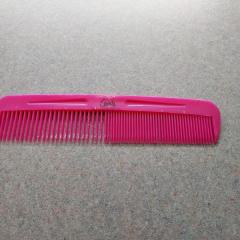 Pink plastic comb found outside, Court covered parking.