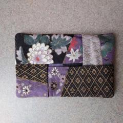 Small, hand made, purse size Kleenex holder left on the Manor counter.