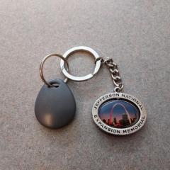 Gateway Arch/St Louis key chain with grey faub found on the Manor 4th floor by the D/E wing.