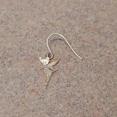Silver Tinkerbell earring outside the Manor.
