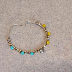 Large wire hoop earring with beads found in front of the Manor on the sidewalk.