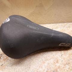 Black bike seat by Cloud 9 found on the NP bench inside the parking lot door by the elevators.