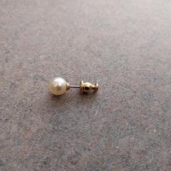 Pearl stud earring found in the Manor second floor laundry room.