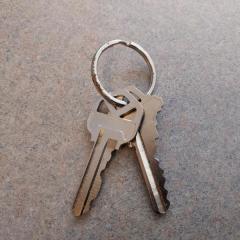 Two silver keys on key ring left and found on the free table.
