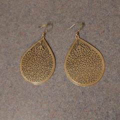 Large gold, teardrop shaped earrings with flower cut outs found in the Health Center parking lot.