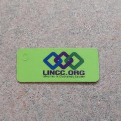 Keychain size library card found by entry of parking lot garages.