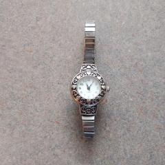 Womens silver watch with heart inlay found at the Terrace front desk.