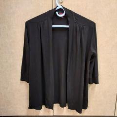 Women's black rayon cardigan by Salaam left in the Manor Library.