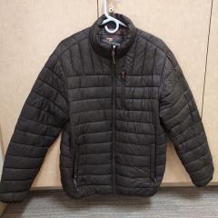 Black puffy coat left in the Court Family Room.