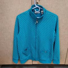 Womens teal jacket with white polka dots found on the NP Patio.