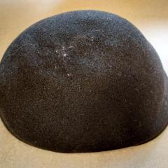Men's wool black cap found in a Manor first floor bathroom.