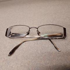 Rectangle wire rim reading glasses Oscar De La Renta found in front of the Manor.