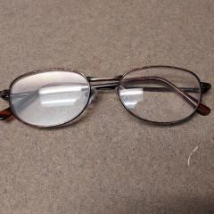 Wire rim reading glasses found in the small Manor elevator.