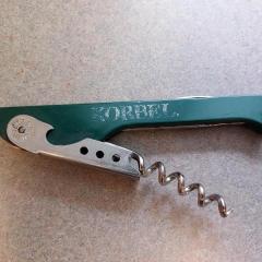 Green and silver wine key by Korbel left at Riverview