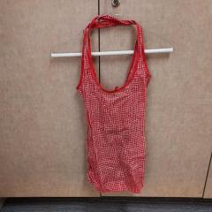 Red/White reusable shopping bag found in the Manor library.