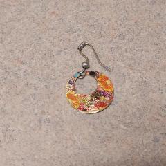 Gold and floral design earring found outside the Court Building.
