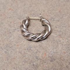 Silver twist hoop found in the Court "I-5" corridor.