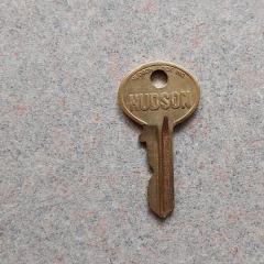 Small gold key by Hudson found on the Manor 7th floor D wing.