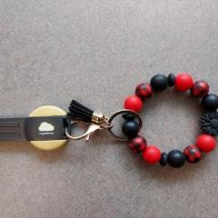 Black and red bracelet keychain with WVI Fitness "key" found in a elevator.