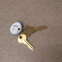 2 gold keys on white tag found on fourth floor, S wing in the Court.