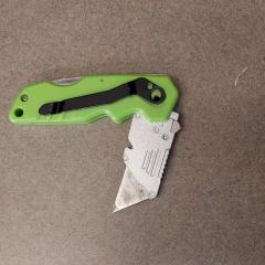Lime green box cutter (by meepo) found in the men's bathroom in the Court Bldg.