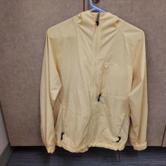 Light yellow windbreaker by Royal Robbins found in the Blue Heron Auditorium.
