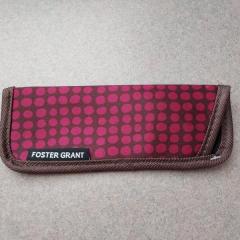 Purple with pink dots glasses case found in the Manor Library.
