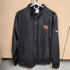 Mens black full zip Nike jacket with Beavers emblem found in the Manor A-wing bathroom.